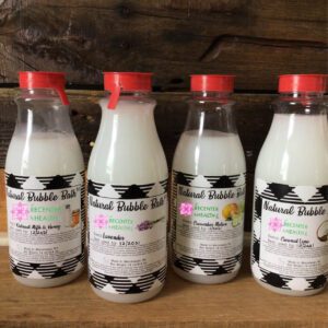Four bottles of natural bubble bath.